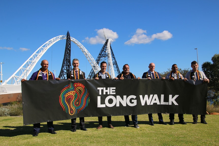 The Long Walk organisers in front of banner