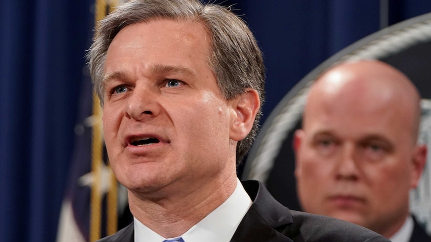 FBI Director Chris Wray address a press conference following charges against Huawei.