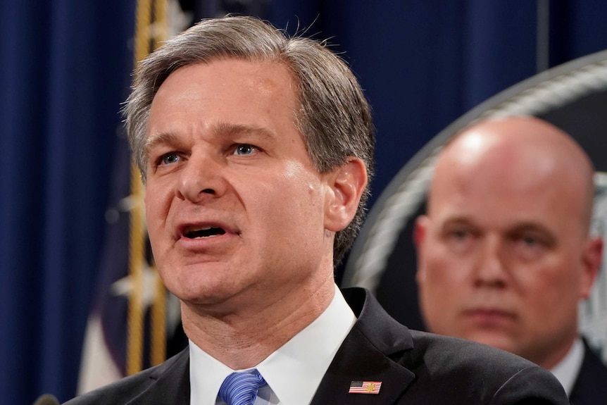 FBI Director Chris Wray address a press conference following charges against Huawei.