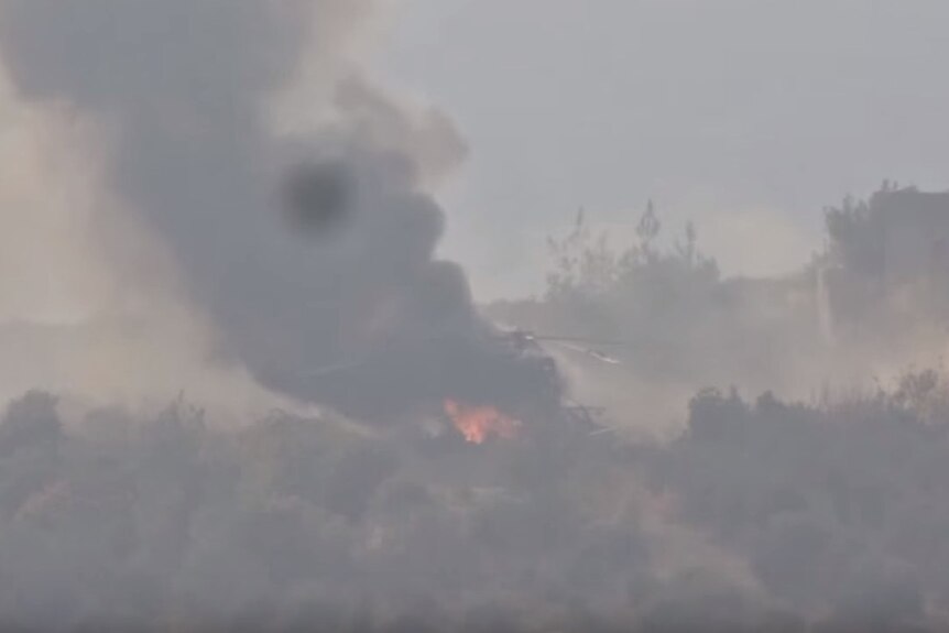 Helicopter burning after being struck by Syrian rebels according to video