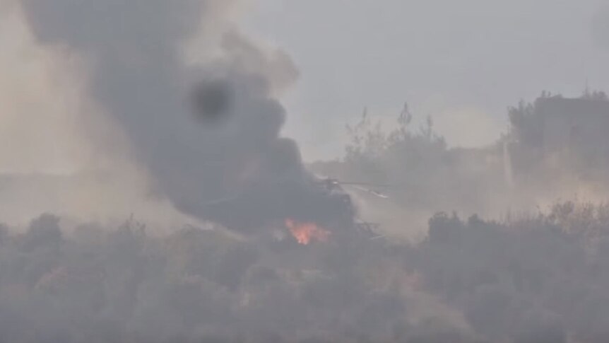 Helicopter burning after being struck by Syrian rebels according to video