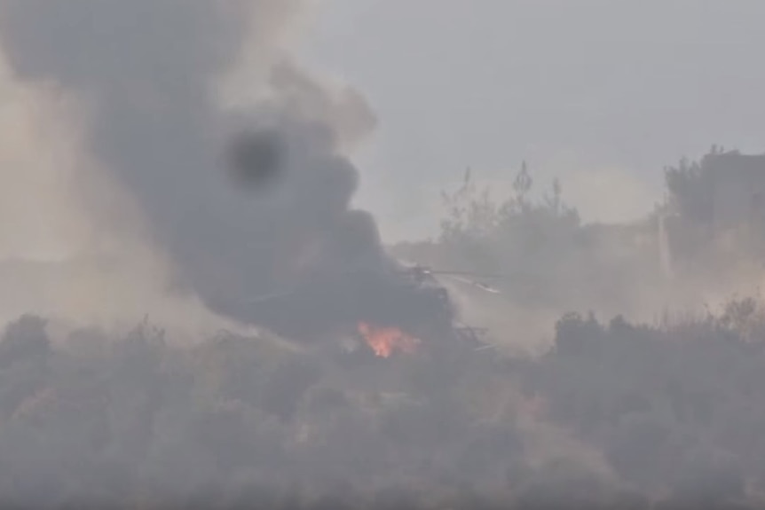 Helicopter burning after being struck by Syrian rebels according to video