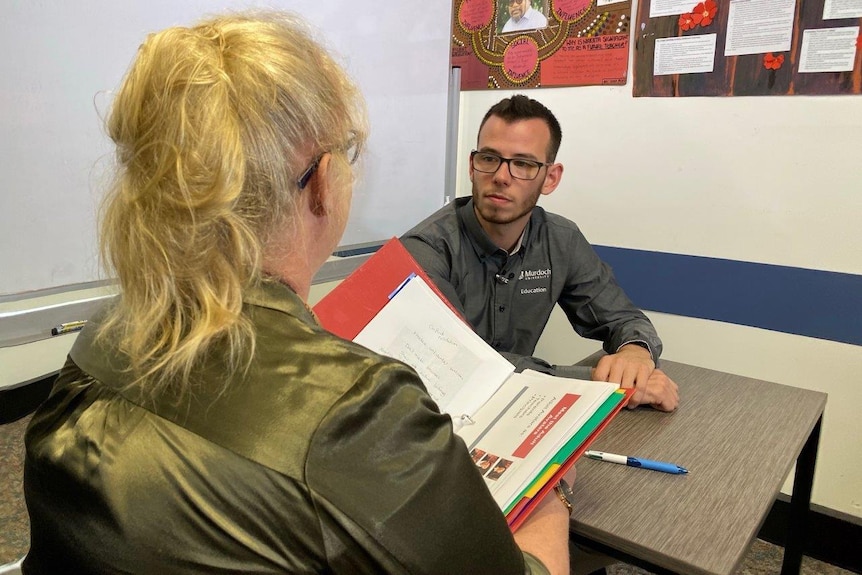 Student teacher Jabe Stillitano undergoes a debrief after his session with an irate parent.