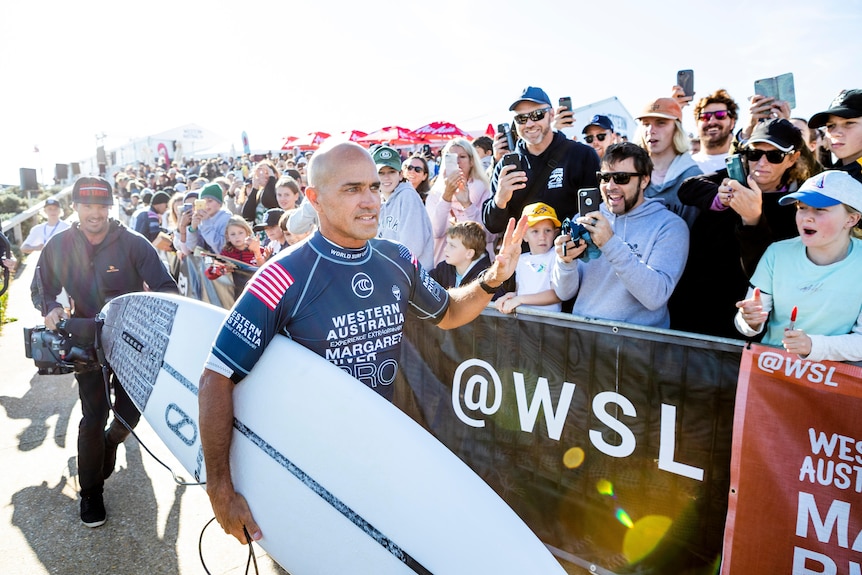 11-time WSL Champion Kelly Slater high-fiving fans after winning heat six of round three at 2019 Margaret River Pro 