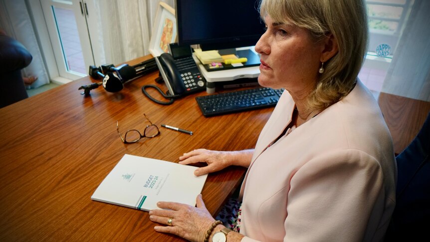 Northern Territory Treasurer Eva Lawler sits in her office with the 2023/24 NT budget.