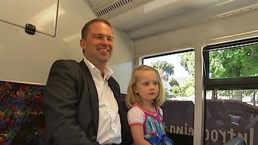 David Bartlett and his daughter Matilda catch a Metro bus in Hobart