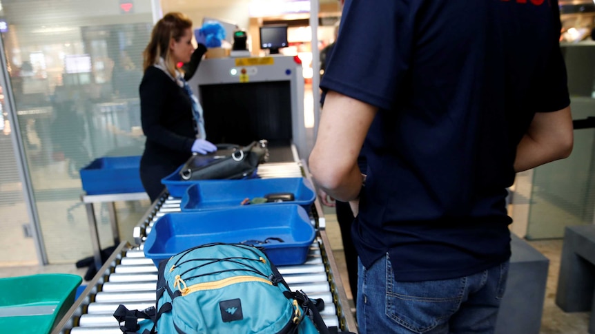 Staff demonstrate the flow of passengers through security