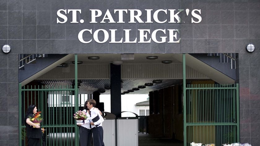 Mourners have placed floral tributes at the school.