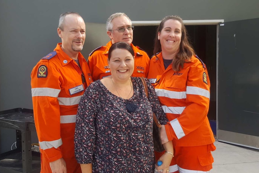 Helen Gallo smiles with Chris Holloway, Jim Ferguson and Claire Browning behind her