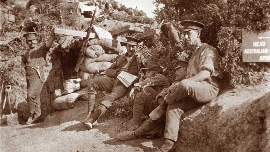 Gallipoli Peninsula, Turkey, May 1915. Five unidentified soldiers sitting on the road up to Plugge’s Plateau.