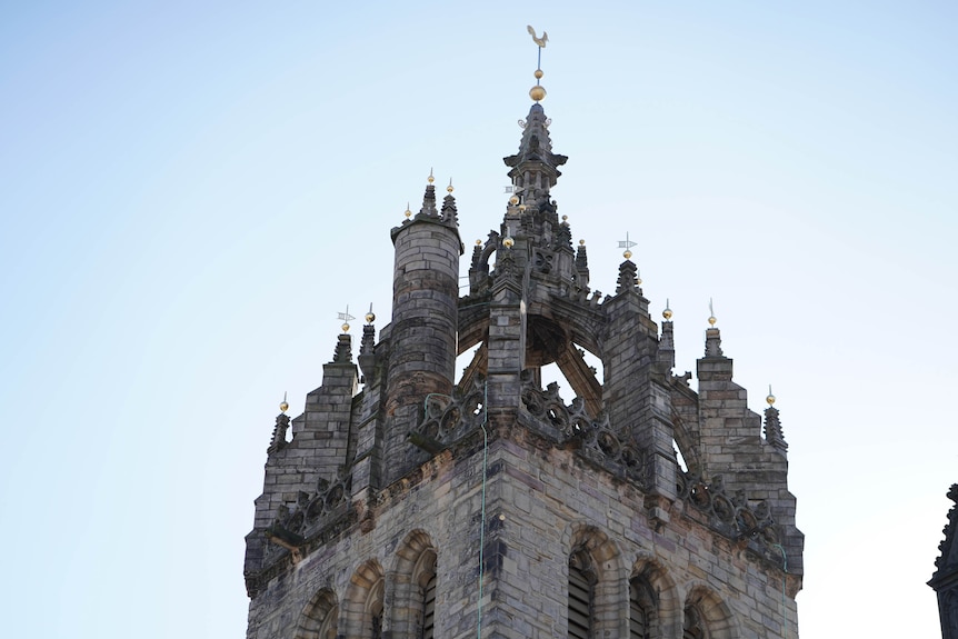 Giles' Cathedral spire against a blue sky