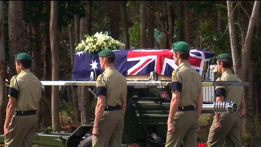 Soldiers follow the coffin procession at a funeral for Private Ben Chuck at Lake Tinaroo.