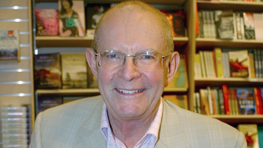 Author Wilbur Smith smiles as he poses during a book signing in Sydney, Australia