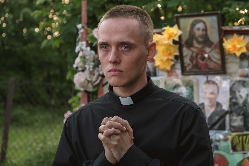 A scene from the film Corpus Christi with a young man in priest's clothes