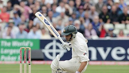 Justin Langer reels after being hit