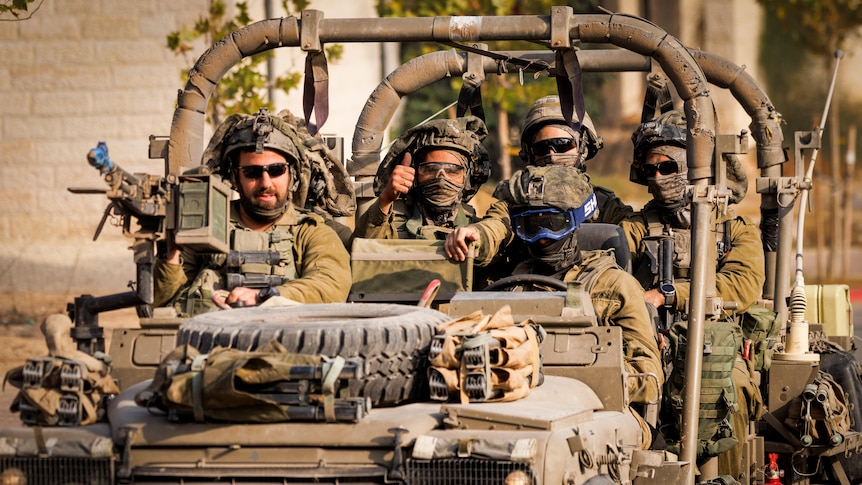 A group of soldiers in a vehicle 