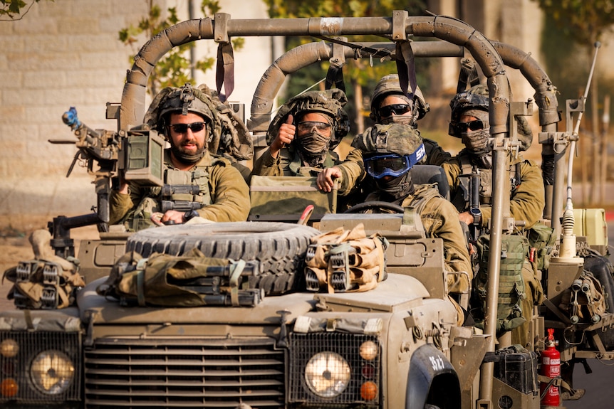 A group of soldiers in a vehicle 