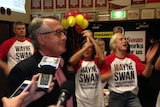 Wayne Swan celebrates after retaining his Brisbane seat of Lilley.