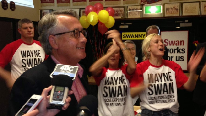 Wayne Swan celebrates after retaining his Brisbane seat of Lilley.
