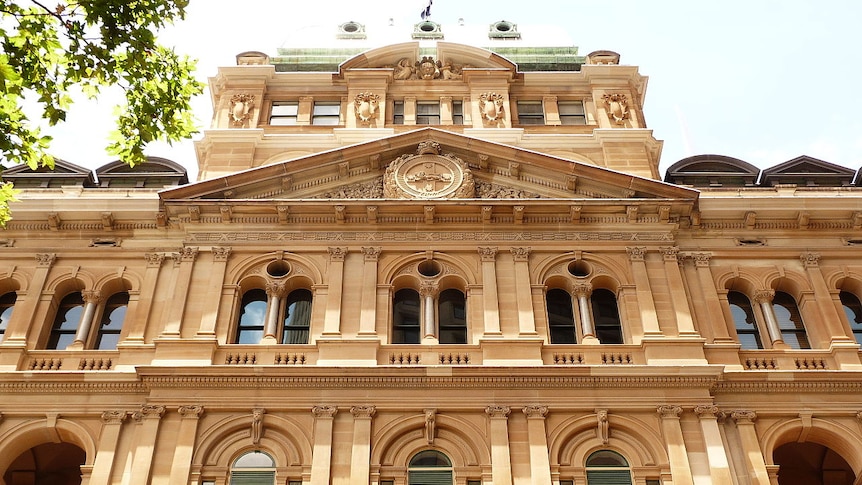 A large sandstone building.