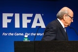 Sepp Blatter leaves stage after quitting
