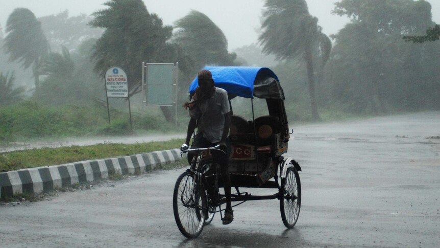 Rickshaw driver in Cyclone Phailin