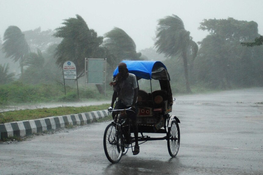 Rickshaw driver in Cyclone Phailin