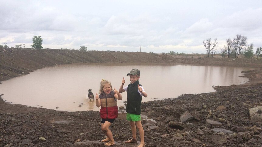 Kids play in rain near Clermont