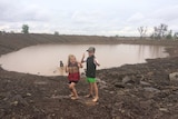 Kids play in rain near Clermont