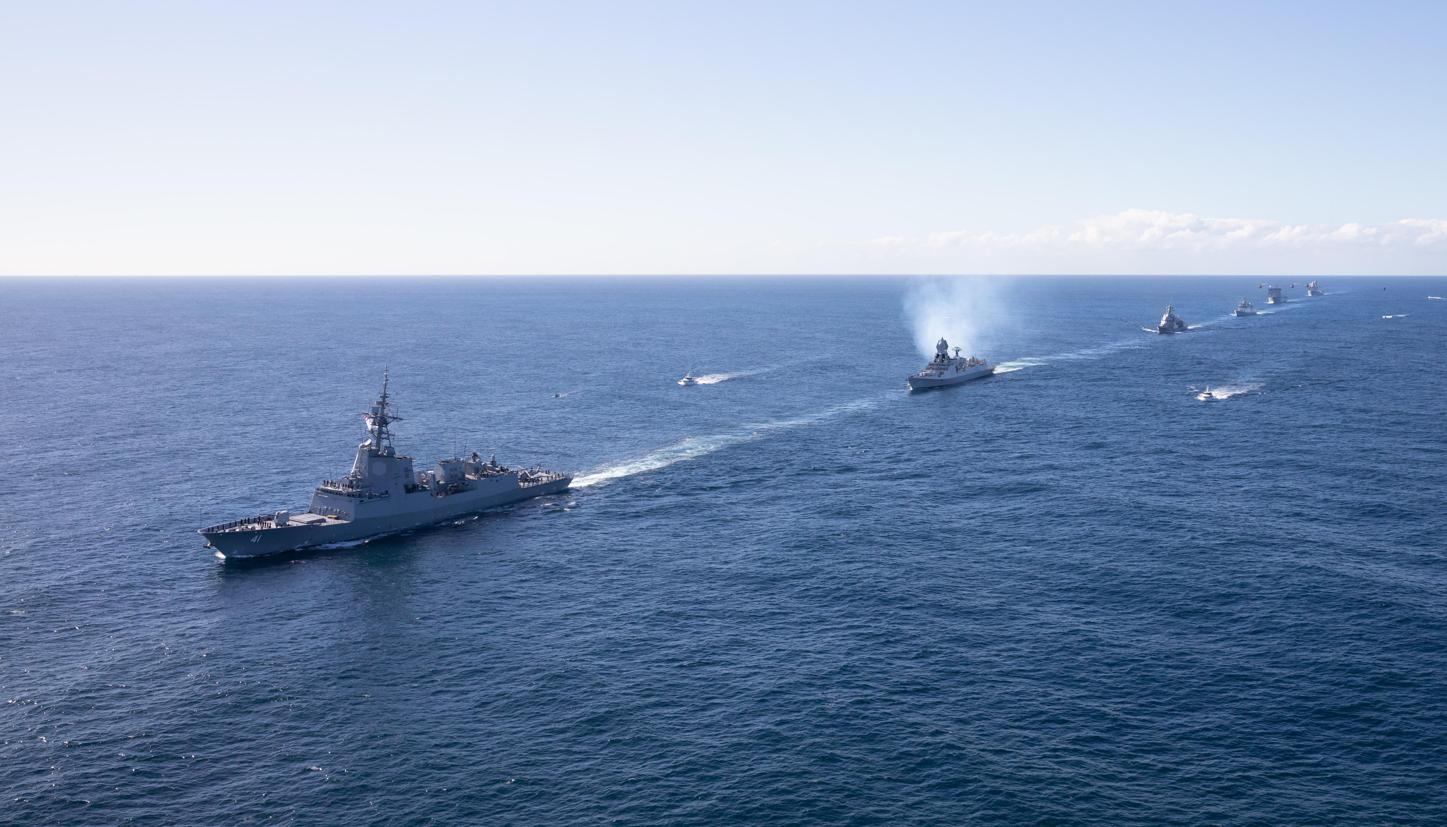 A view of Defence ships on the open sea.