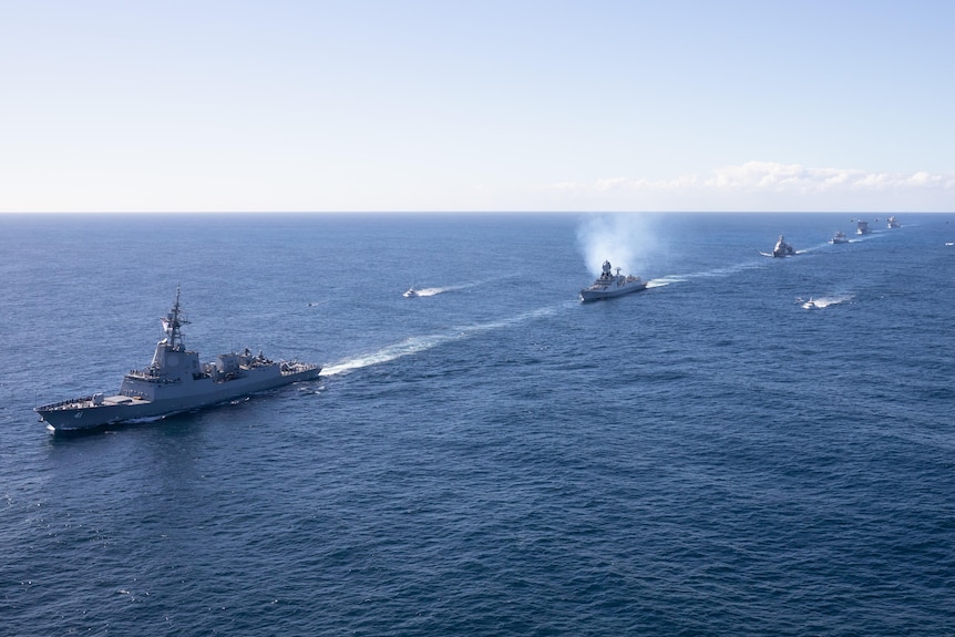 A view of Defence ships on the open sea.