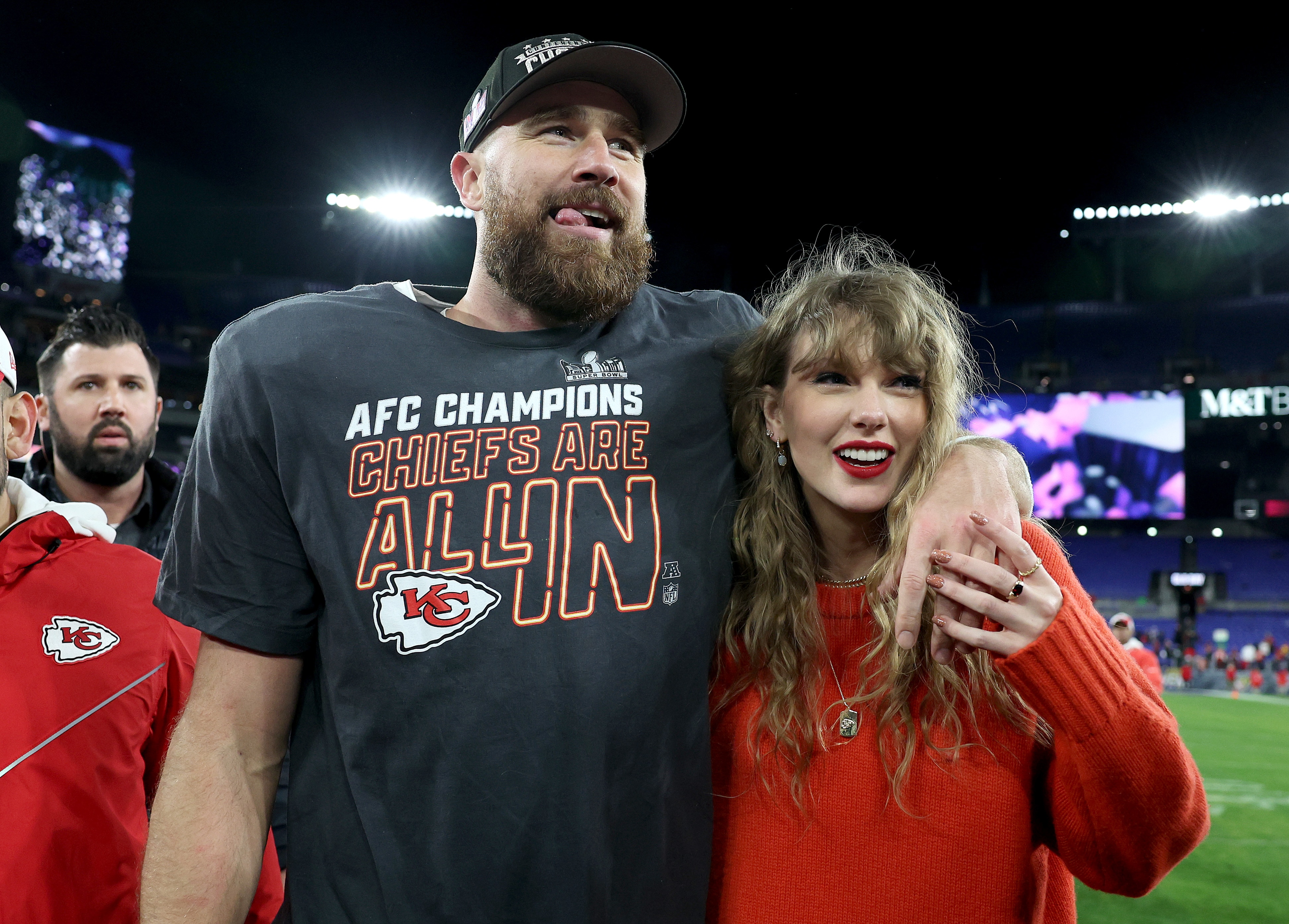A man and a woman celebrate winning an NFL playoff game 