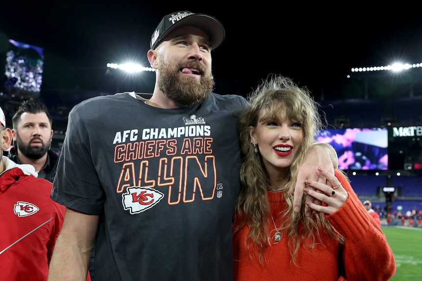 A man and a woman celebrate winning an NFL playoff game 