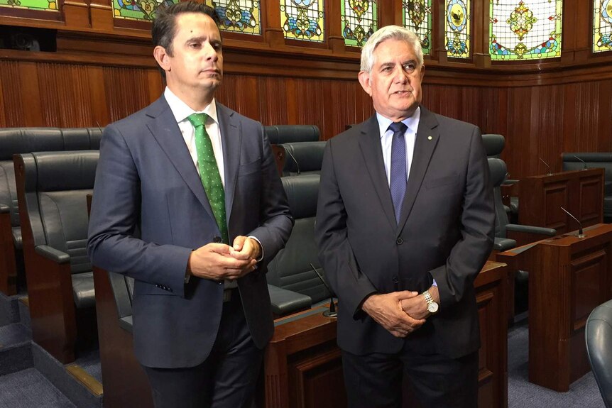 Ben and ken Wyatt stand side-by-side in WA's Legislative Assembly chamber.