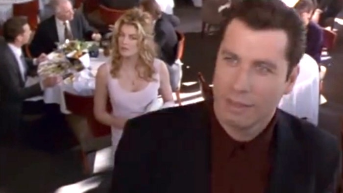 John Travolta and Rene Russo in a scene from the film Get Shorty, based on Elmore Leonard's novel.