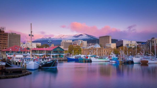 Snow dusts Mt Wellington as the sun rises in Hobart