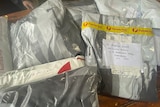 postage sacks with 'nobody denim' on them