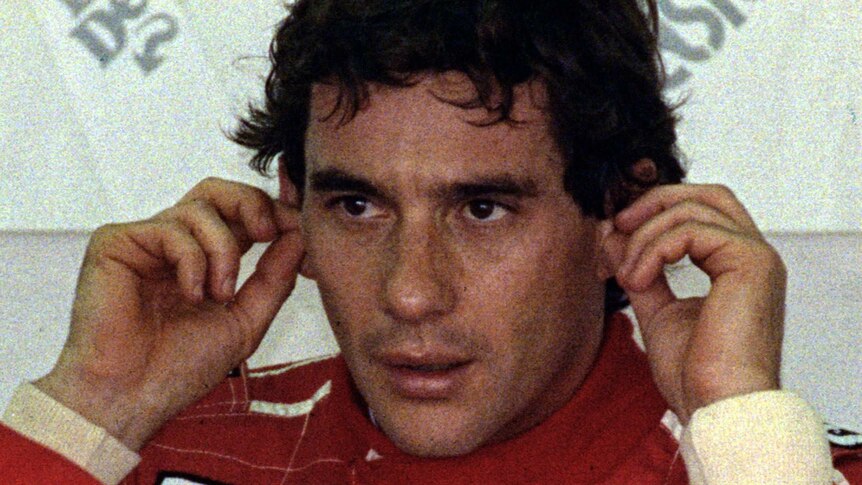 Ayrton Senna puts in his earplugs