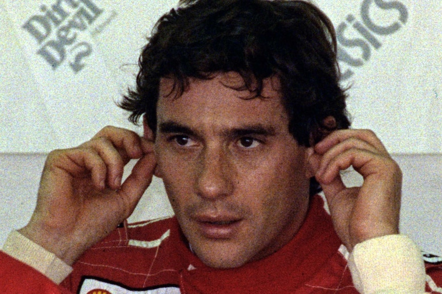 Ayrton Senna puts in his earplugs
