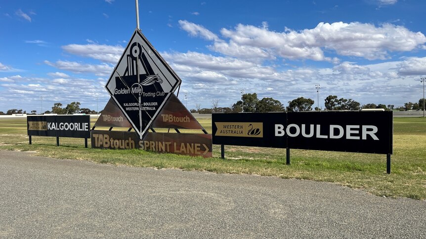 A sign saying Golden Mile Trotting Club at the edge of an oval in Kalgoorlie.