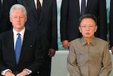 LtoR (seated) Former US president Bill Clinton and North Korea's leader Kim Jong-il pose for photo