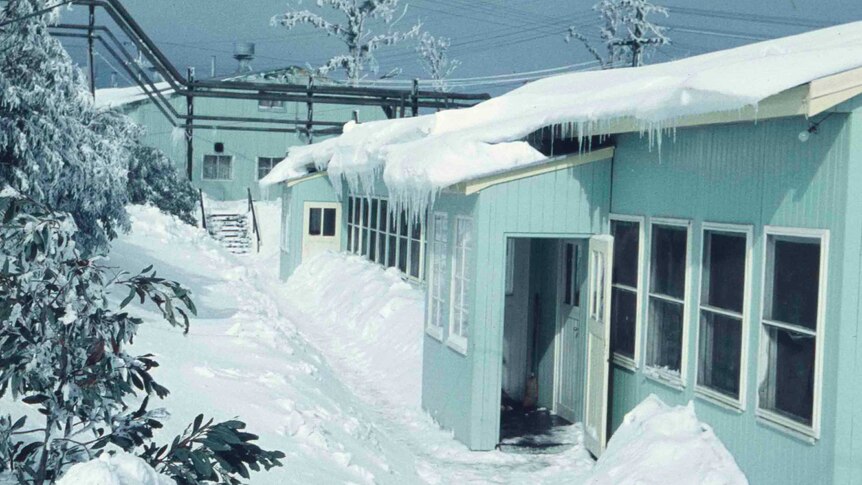 Archival image of snow-covered scene in 1950s town.