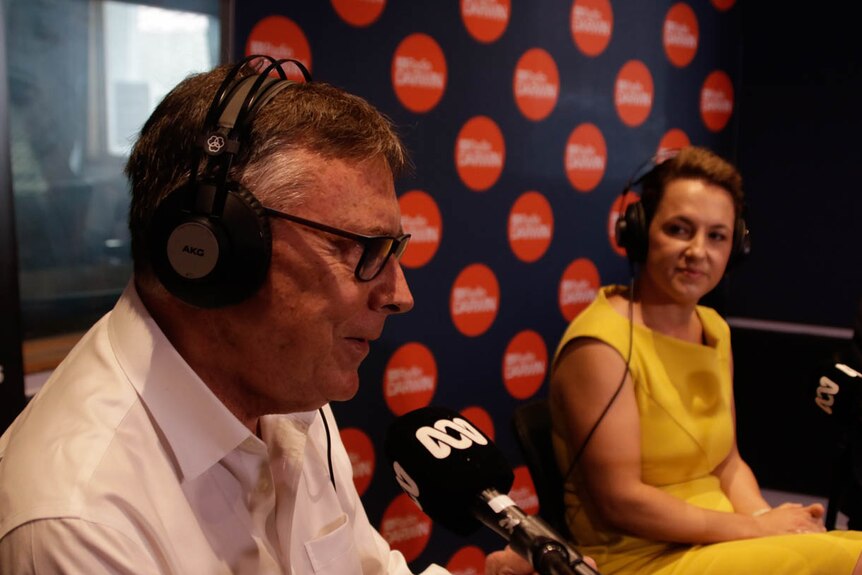 Territory Alliance leader Terry Mills speaks at a microphone inside the ABC Darwin radio room.