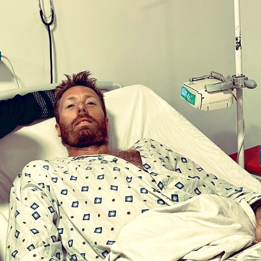 Image of a man in a hospital bed