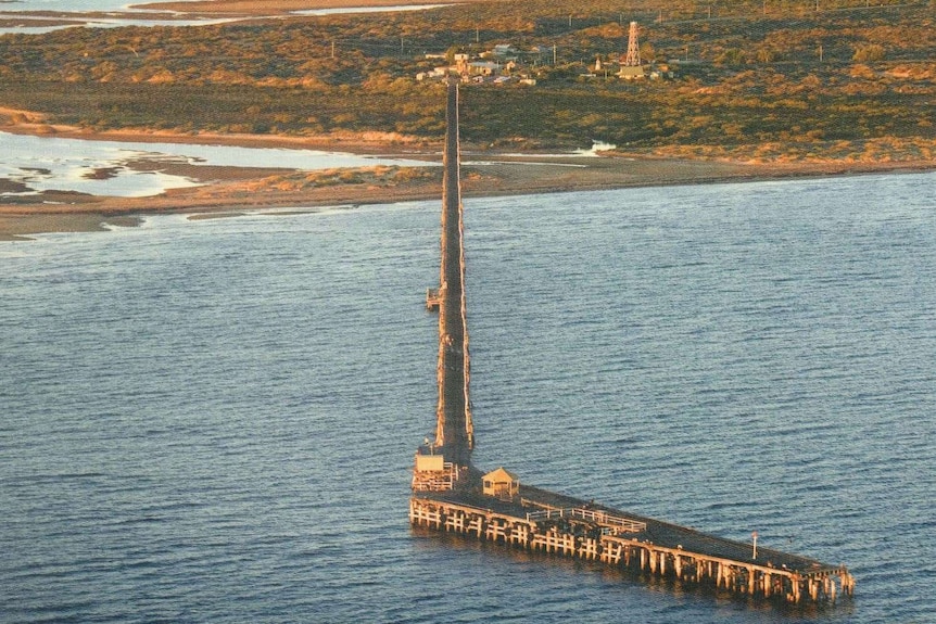 An aerial view of a one-mile-long jetty in Carnarvon, WA