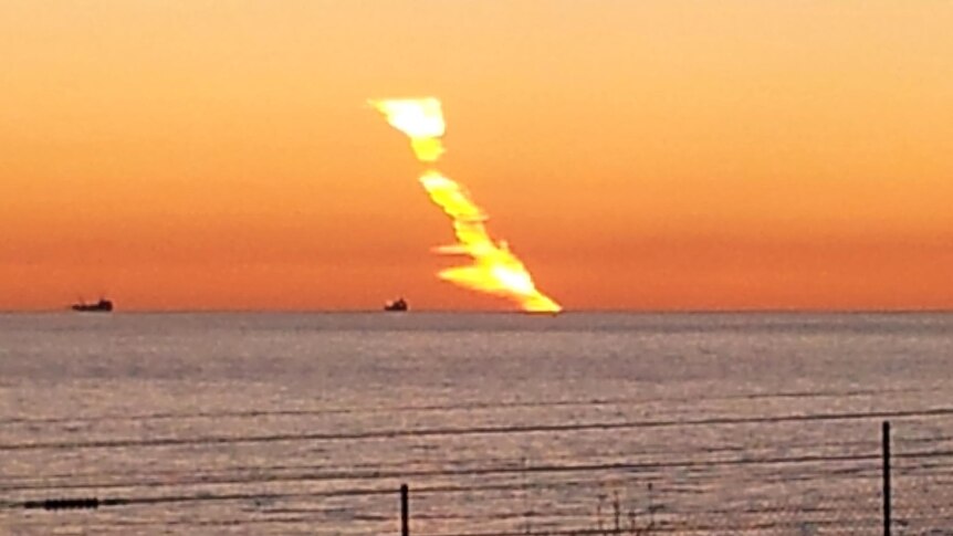 A suspected meteor plunges into the ocean off the coast of Perth.
