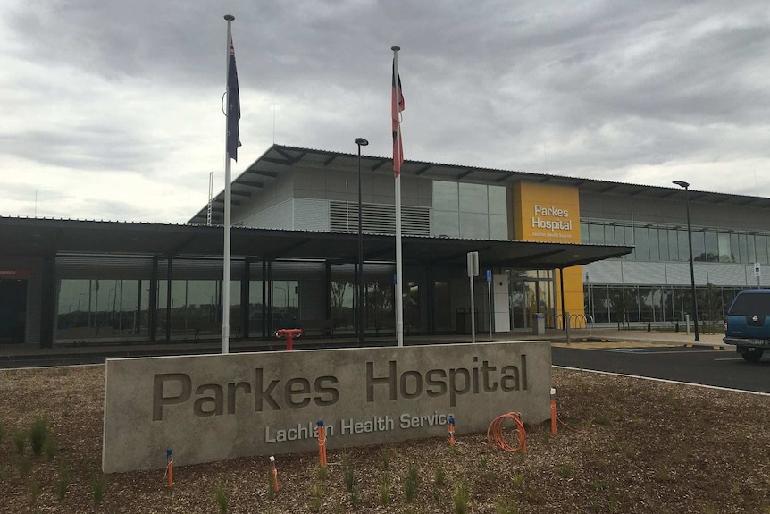 A close of Parkes Hospital sign outside the hospital