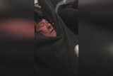 Man dragged off United Airlines flight