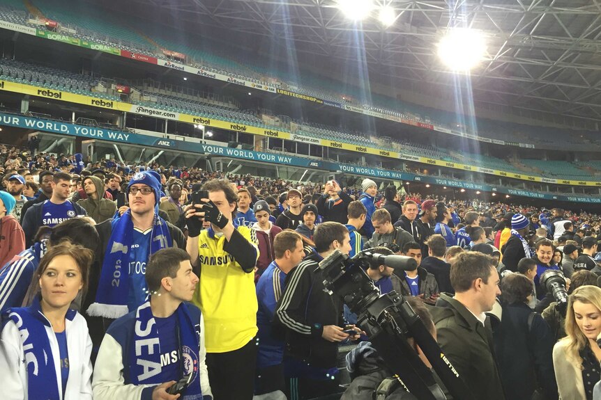 Chelsea fans watching their team at training in Sydney.