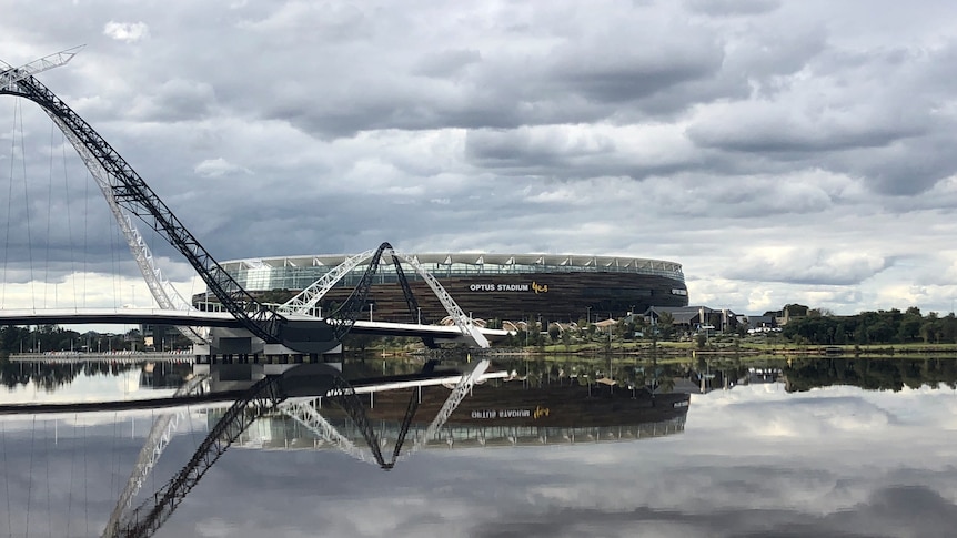 A wide shot showing Perth Stadium and Matagarup Bridge behind the Swan River.